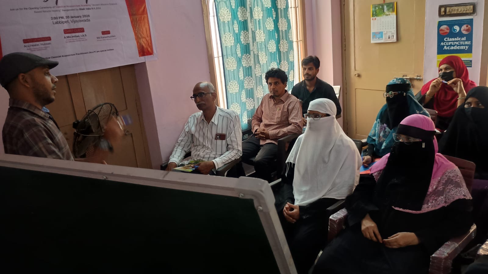 An acupuncture training class in session at the academy