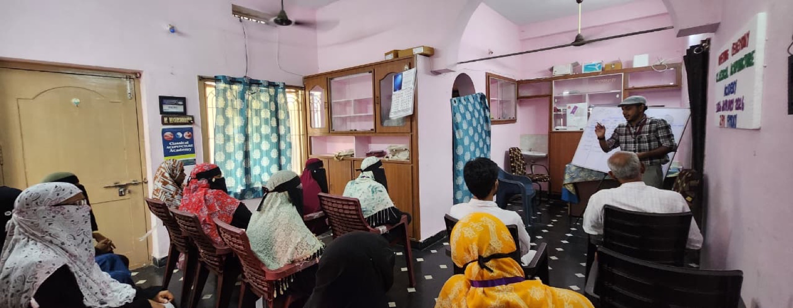 Students in a classroom learning session at the academy